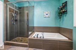 Bathroom with a bath and a shower stall - 