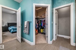 Bathroom with a spacious closet, ensuite bath, and wood tiled floors - 