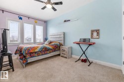 Bedroom featuring carpet flooring and a ceiling fan - 