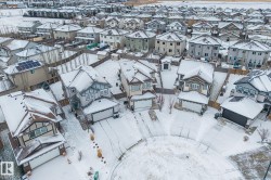 Snowy aerial view featuring a residential view - 