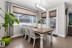 Dining room featuring dark wood-type flooring - 