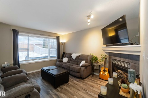 109 Rue Magnan, Beaumont, AB - Indoor Photo Showing Living Room With Fireplace