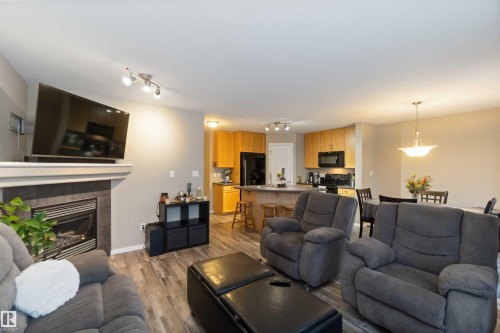 109 Rue Magnan, Beaumont, AB - Indoor Photo Showing Living Room With Fireplace