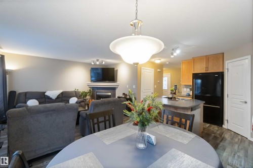109 Rue Magnan, Beaumont, AB - Indoor Photo Showing Dining Room With Fireplace