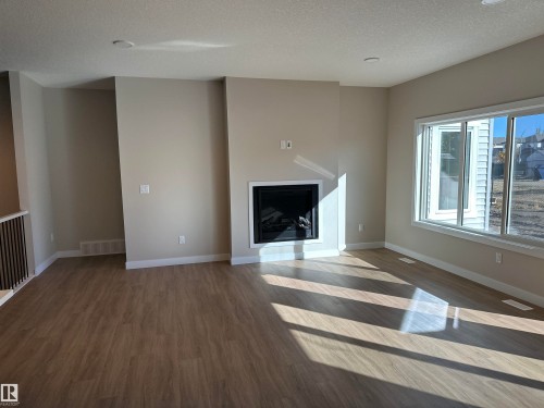 145 Elm Street, Fort Saskatchewan, AB - Indoor Photo Showing Living Room With Fireplace