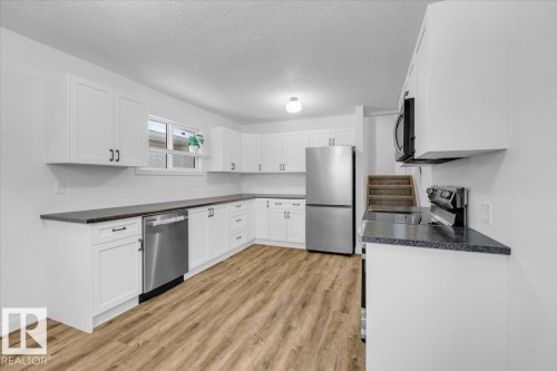 4911 43 Avenue, Beaumont, AB - Indoor Photo Showing Kitchen With Stainless Steel Kitchen