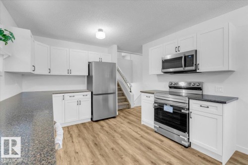 4911 43 Avenue, Beaumont, AB - Indoor Photo Showing Kitchen With Stainless Steel Kitchen