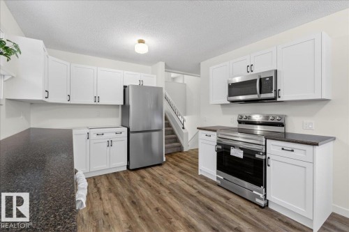 4911 43 Avenue, Beaumont, AB - Indoor Photo Showing Kitchen With Stainless Steel Kitchen