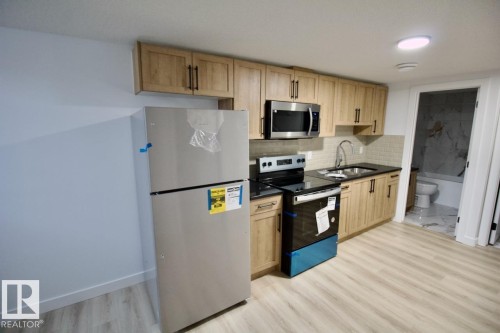 Bsmt 8857 Carson Way, Edmonton, AB - Indoor Photo Showing Kitchen With Double Sink