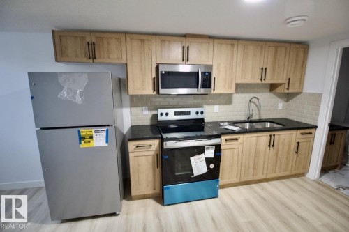 Bsmt 8857 Carson Way, Edmonton, AB - Indoor Photo Showing Kitchen With Double Sink