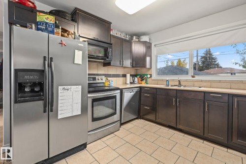 12903/12905 96 Street, Edmonton, AB - Indoor Photo Showing Kitchen With Double Sink