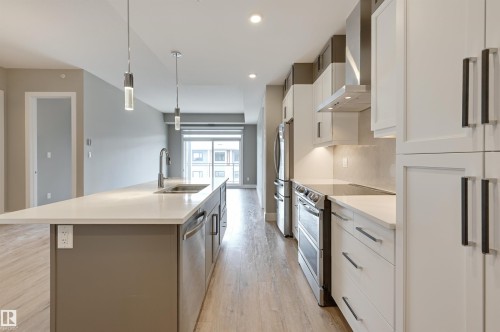 406 528 Griesbach Parade, Edmonton, AB - Indoor Photo Showing Kitchen With Stainless Steel Kitchen With Double Sink With Upgraded Kitchen