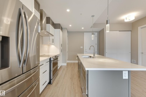 406 528 Griesbach Parade, Edmonton, AB - Indoor Photo Showing Kitchen With Stainless Steel Kitchen With Double Sink With Upgraded Kitchen