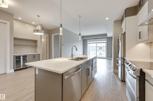 406 528 Griesbach Parade, Edmonton, AB - Indoor Photo Showing Kitchen With Stainless Steel Kitchen With Double Sink With Upgraded Kitchen