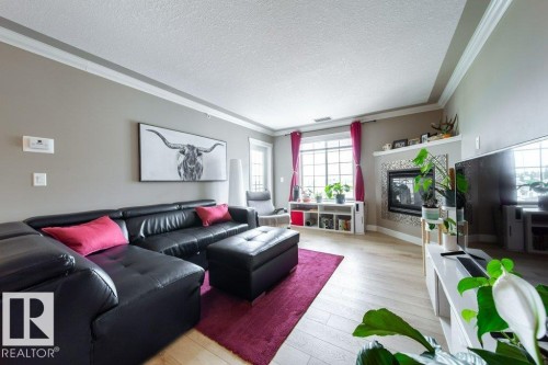 412 16235 51 Street, Edmonton, AB - Indoor Photo Showing Living Room With Fireplace