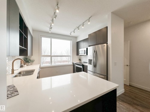 14 100 Jensen Boulevard, St. Albert, AB - Indoor Photo Showing Kitchen With Double Sink With Upgraded Kitchen