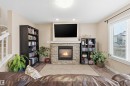 140 Axbridge Gate, Sherwood Park, AB  - Indoor Photo Showing Living Room With Fireplace 