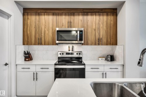 98 Kingsbury Circle, Spruce Grove, AB - Indoor Photo Showing Kitchen With Double Sink
