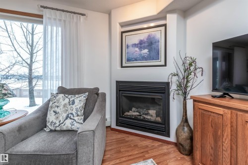 134 200 Bethel Drive, Sherwood Park, AB - Indoor Photo Showing Living Room With Fireplace