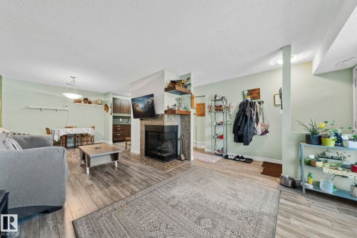 33 2204 118 Street, Edmonton, AB - Indoor Photo Showing Living Room With Fireplace