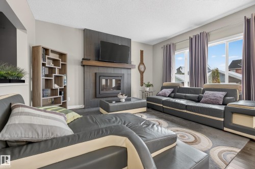 7816 18 Avenue, Edmonton, AB - Indoor Photo Showing Living Room With Fireplace