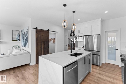 153 Westbrook Wynd, Fort Saskatchewan, AB - Indoor Photo Showing Kitchen With Double Sink With Upgraded Kitchen