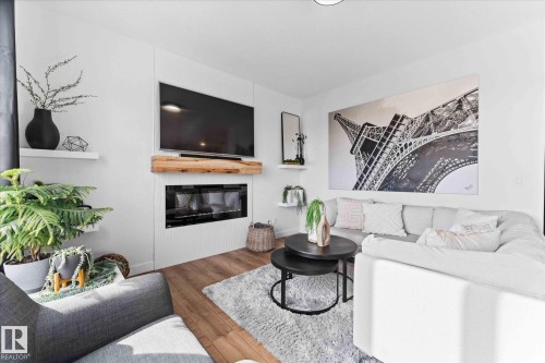 153 Westbrook Wynd, Fort Saskatchewan, AB - Indoor Photo Showing Living Room With Fireplace