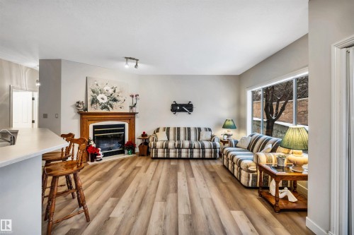 6 20 Erin Ridge Road, St. Albert, AB - Indoor Photo Showing Living Room With Fireplace
