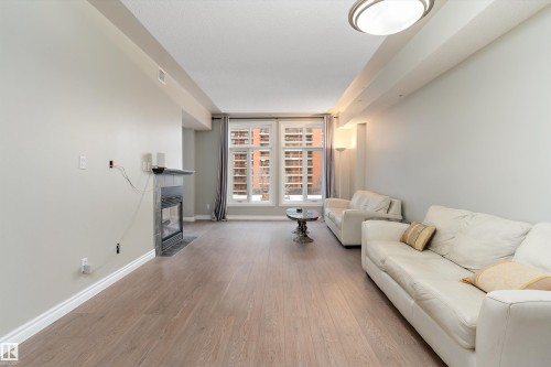 402 9020 Jasper Avenue, Edmonton, AB - Indoor Photo Showing Living Room With Fireplace