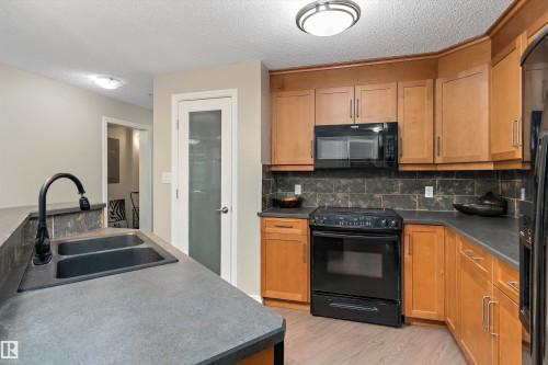 402 9020 Jasper Avenue, Edmonton, AB - Indoor Photo Showing Kitchen With Double Sink