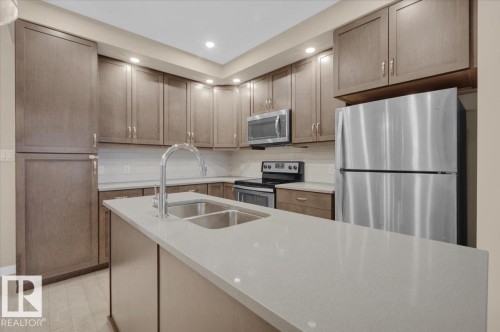 227 1008 Rosenthal Boulevard, Edmonton, AB - Indoor Photo Showing Kitchen With Double Sink With Upgraded Kitchen