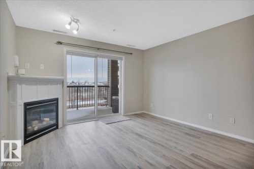 313 2098 Blackmud Creek Drive, Edmonton, AB - Indoor Photo Showing Living Room With Fireplace