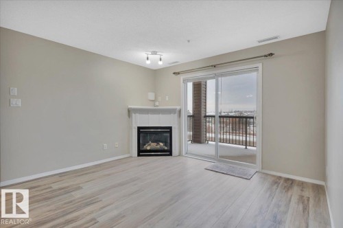 313 2098 Blackmud Creek Drive, Edmonton, AB - Indoor Photo Showing Living Room With Fireplace