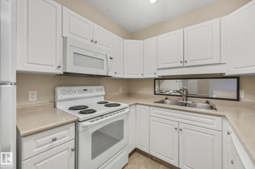 216 13625 34 Street, Edmonton, AB - Indoor Photo Showing Kitchen With Double Sink