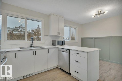 44 Athapaskan Drive, Leduc, AB - Indoor Photo Showing Kitchen With Double Sink