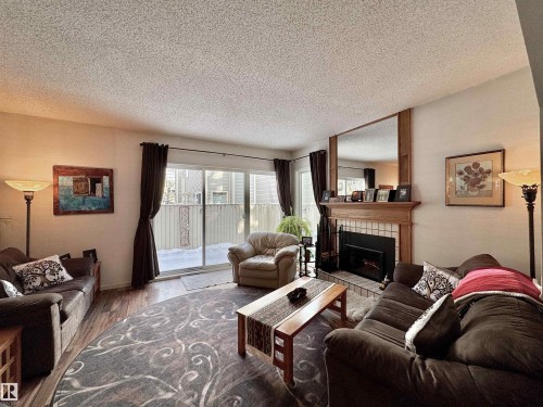 1035 109 St, Edmonton, AB - Indoor Photo Showing Living Room With Fireplace