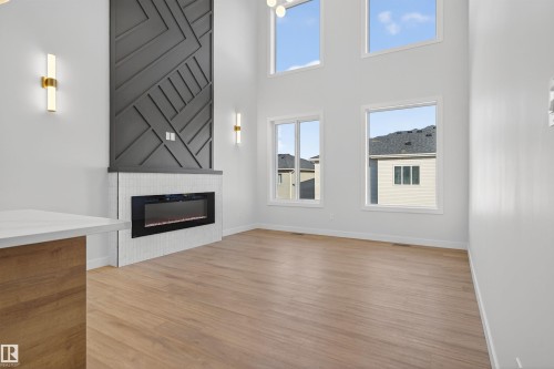 19 Hull Wynd, Spruce Grove, AB - Indoor Photo Showing Other Room With Fireplace