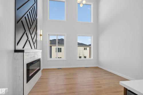 19 Hull Wynd, Spruce Grove, AB - Indoor Photo Showing Other Room With Fireplace
