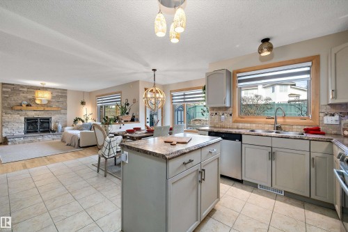 1060 Wedgewood Boulevard, Edmonton, AB - Indoor Photo Showing Kitchen With Fireplace With Double Sink