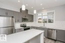 101 320 Secord Boulevard, Edmonton, AB  - Indoor Photo Showing Kitchen With Stainless Steel Kitchen With Double Sink With Upgraded Kitchen 