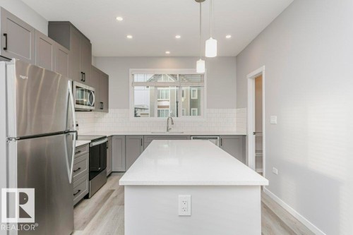 101 320 Secord Boulevard, Edmonton, AB - Indoor Photo Showing Kitchen With Stainless Steel Kitchen With Upgraded Kitchen