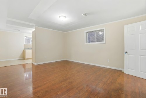 Spare room with hardwood / wood-style flooring and crown molding - 3316 24 Avenue, Edmonton, AB - Indoor Photo Showing Other Room