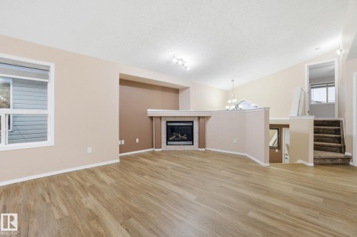 3316 24 Avenue, Edmonton, AB - Indoor Photo Showing Living Room With Fireplace