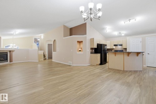 3316 24 Avenue, Edmonton, AB - Indoor Photo Showing Kitchen With Fireplace