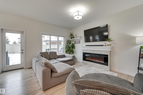 7234 Chivers Place, Edmonton, AB - Indoor Photo Showing Living Room With Fireplace