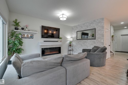 7234 Chivers Place, Edmonton, AB - Indoor Photo Showing Living Room With Fireplace