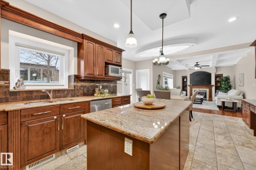 49 Loiselle Way, St. Albert, AB - Indoor Photo Showing Kitchen With Fireplace