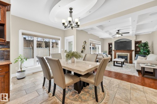 49 Loiselle Way, St. Albert, AB - Indoor Photo Showing Dining Room With Fireplace