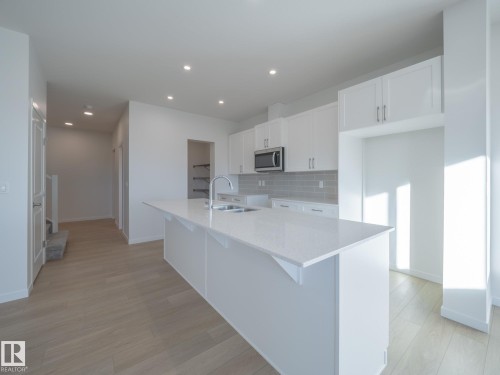 104 Nerine Crescent, St. Albert, AB - Indoor Photo Showing Kitchen With Double Sink With Upgraded Kitchen