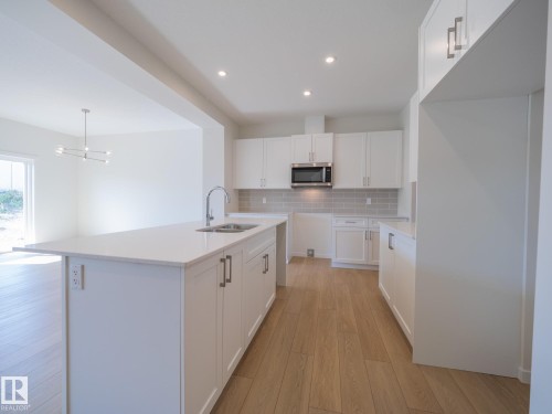17728 7 Street, Edmonton, AB - Indoor Photo Showing Kitchen With Double Sink With Upgraded Kitchen